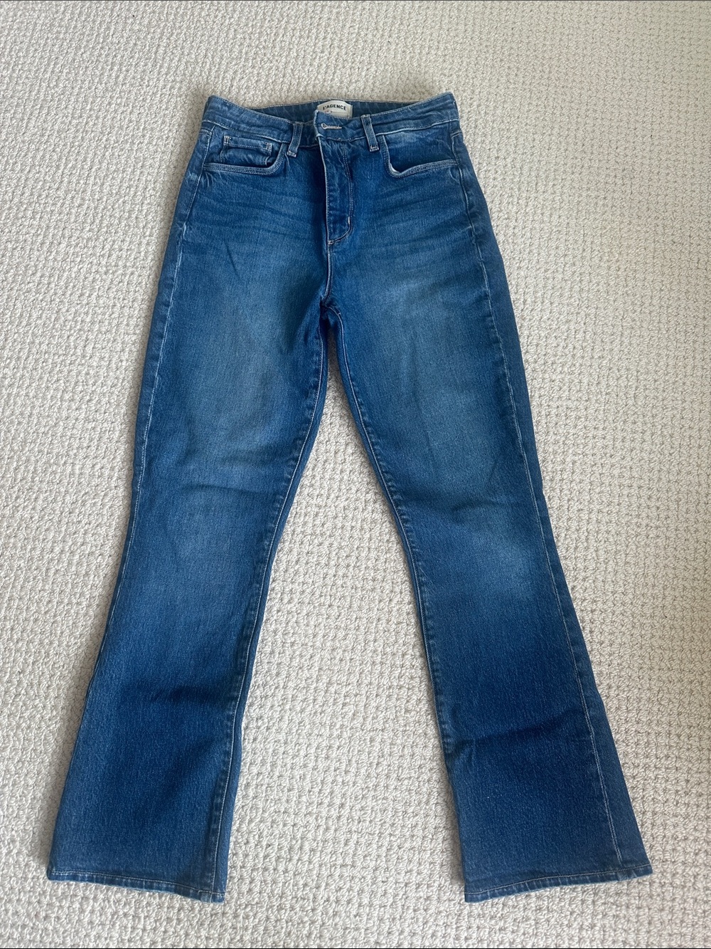 L'AGENCE Mid-Rise Flare Jeans in Washed Blue